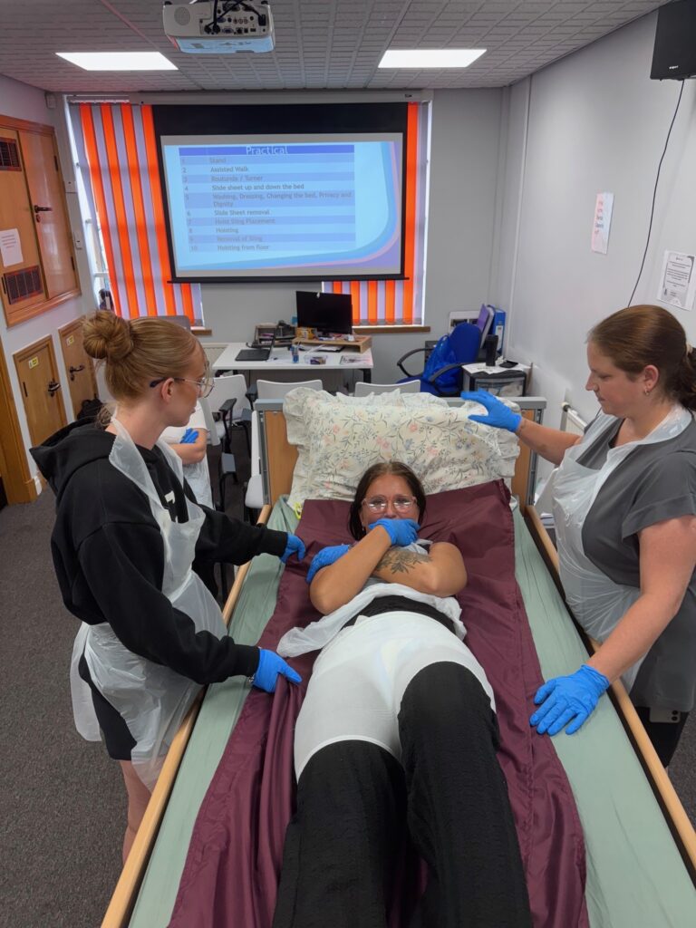 Three of our new starters at their induction training, all of them wearing PPE.