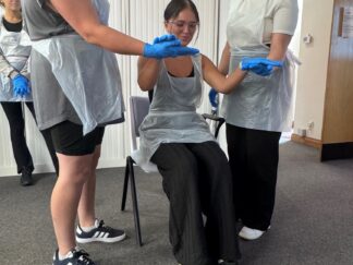 Training at one of our offices for our new starters featuring three of our new carers.