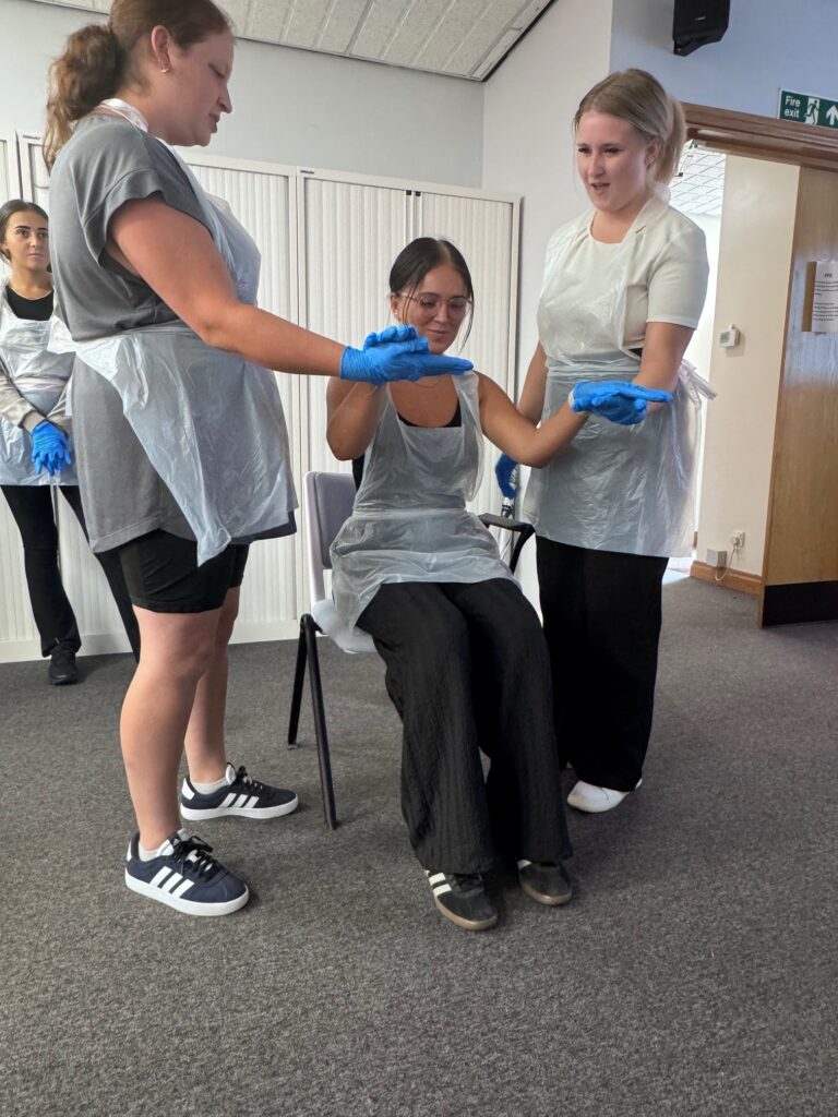 Training at one of our offices for our new starters featuring three of our new carers.